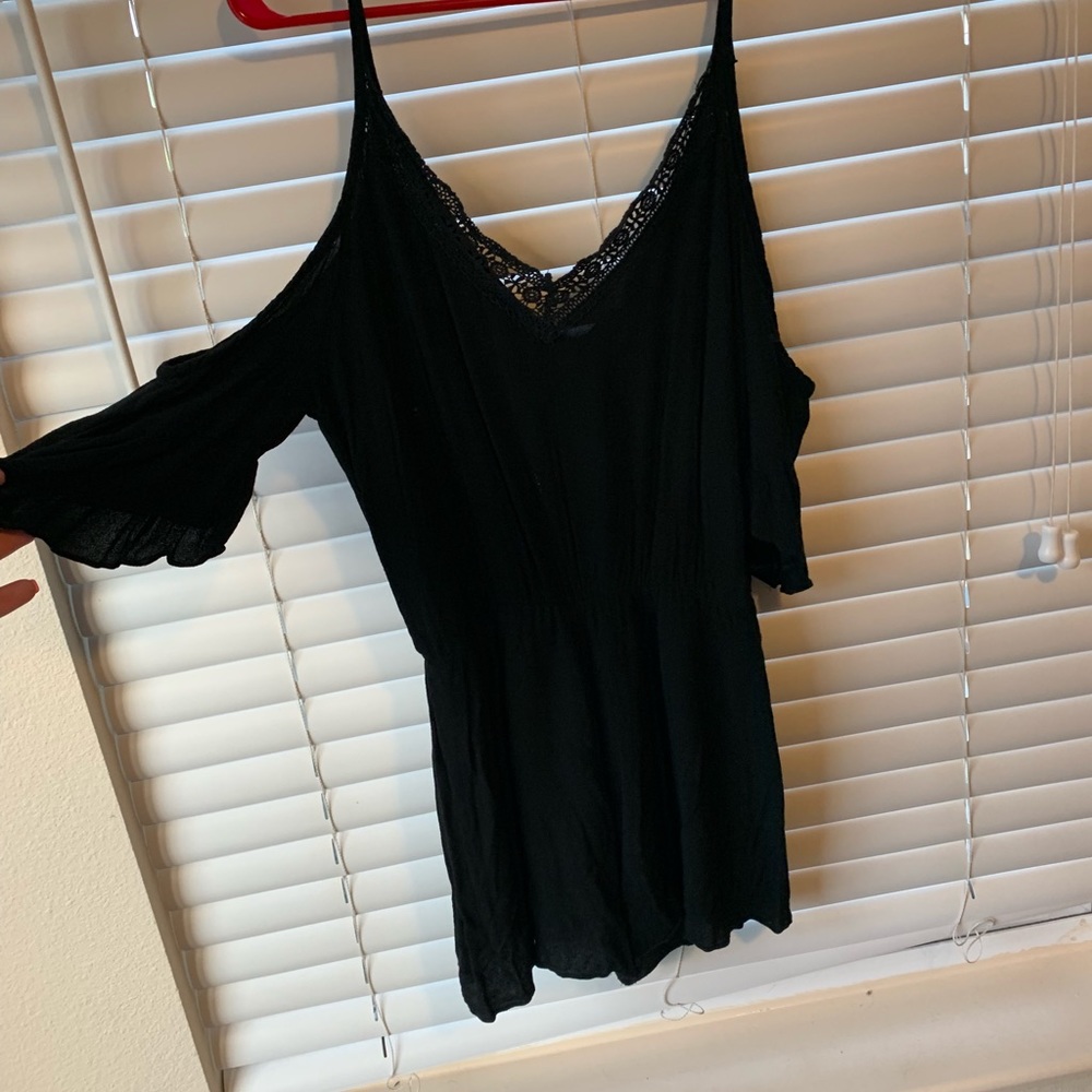 cold shoulder romper with lace detail in front.
